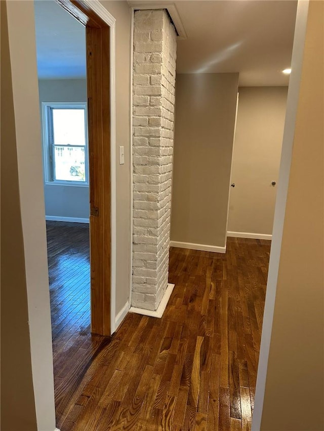 hall with dark wood-type flooring