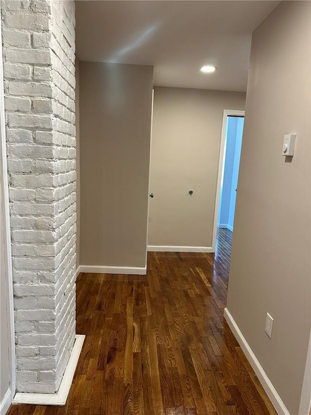 hallway featuring dark wood-type flooring