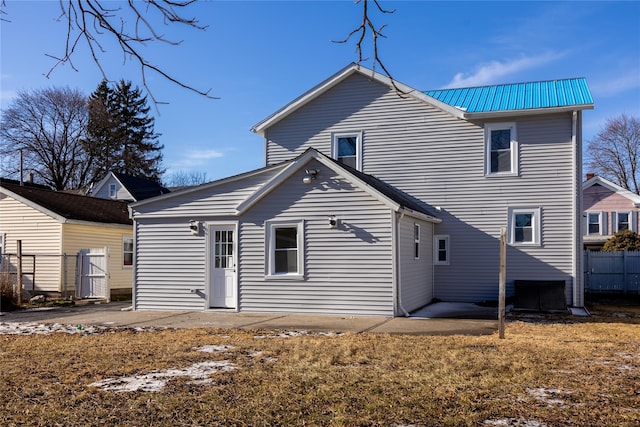 back of property featuring a patio