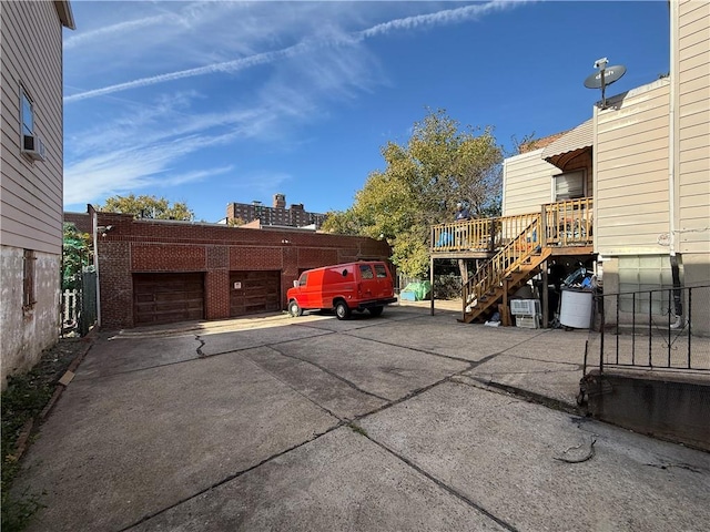 view of parking / parking lot featuring a garage