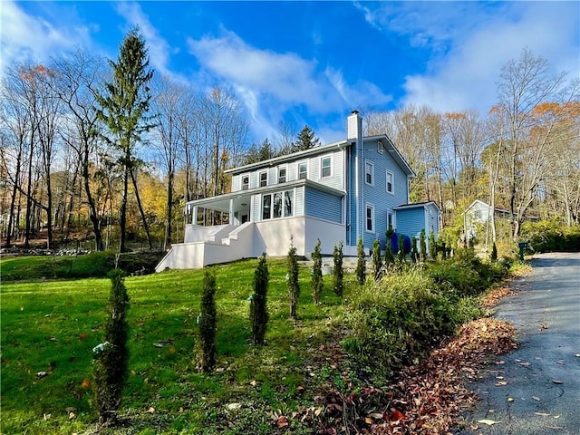 view of home's exterior featuring a yard