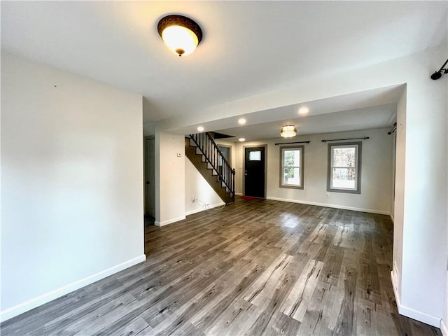 unfurnished living room with hardwood / wood-style flooring