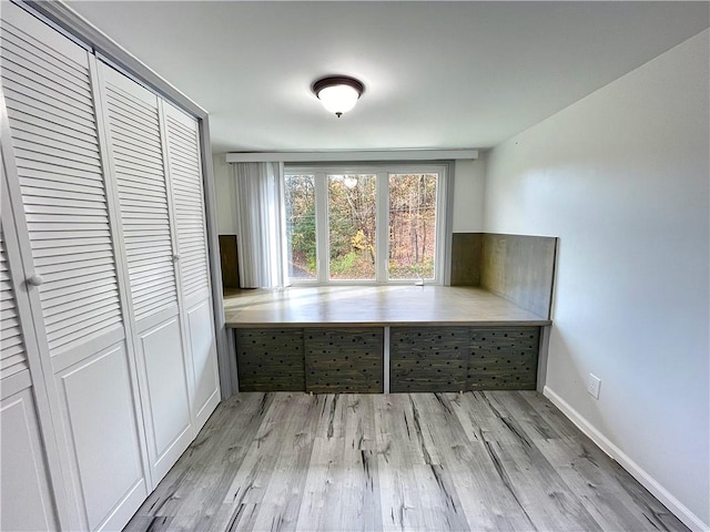 unfurnished dining area with light hardwood / wood-style flooring