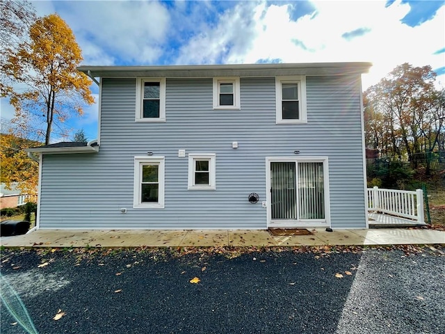 back of property with a patio