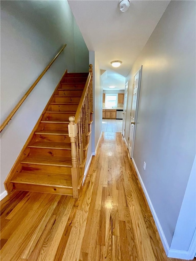 stairway featuring hardwood / wood-style floors