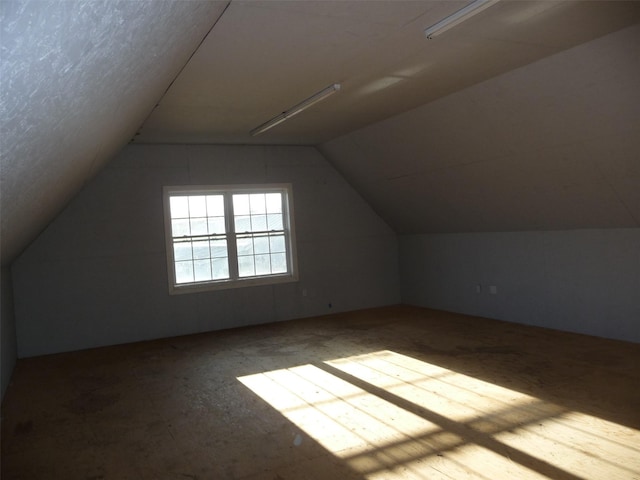 bonus room featuring lofted ceiling