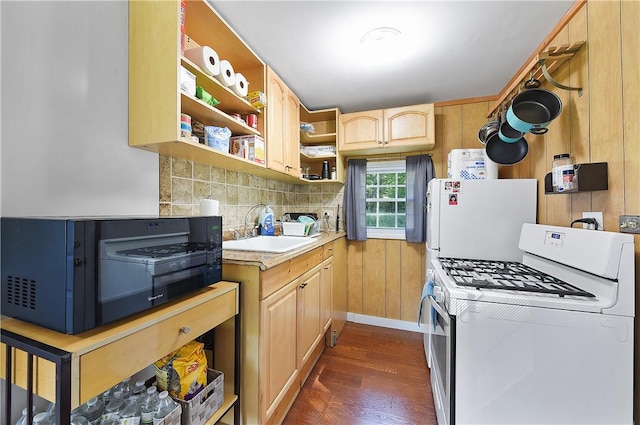 kitchen with light brown cabinets, white appliances, dark wood-type flooring, sink, and decorative backsplash