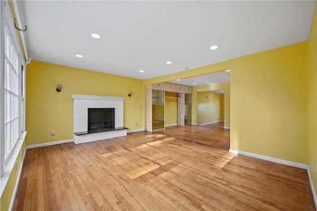 unfurnished living room with light hardwood / wood-style floors