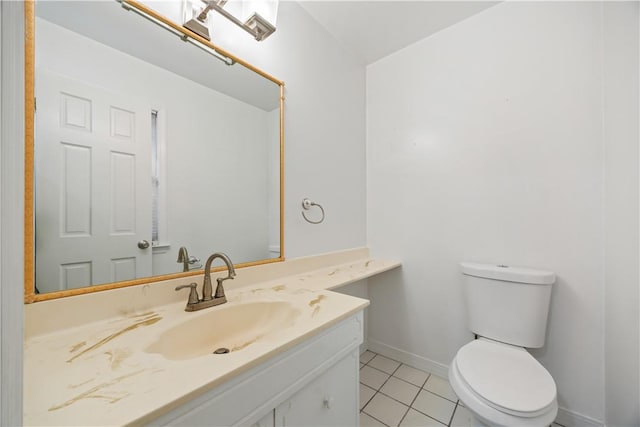 bathroom with tile patterned floors, vanity, and toilet