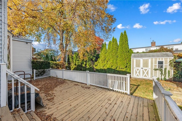 wooden terrace featuring a storage unit