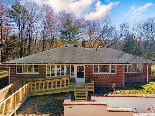 back of property featuring a deck