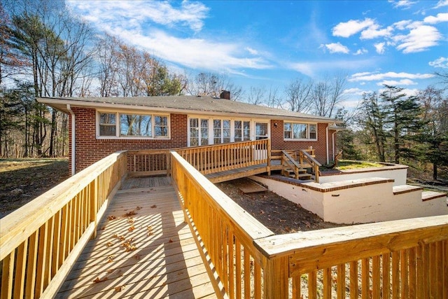 back of house with a wooden deck