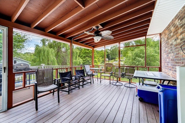 wooden deck featuring ceiling fan