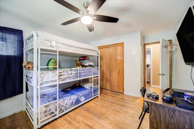 bedroom featuring light hardwood / wood-style floors and ceiling fan