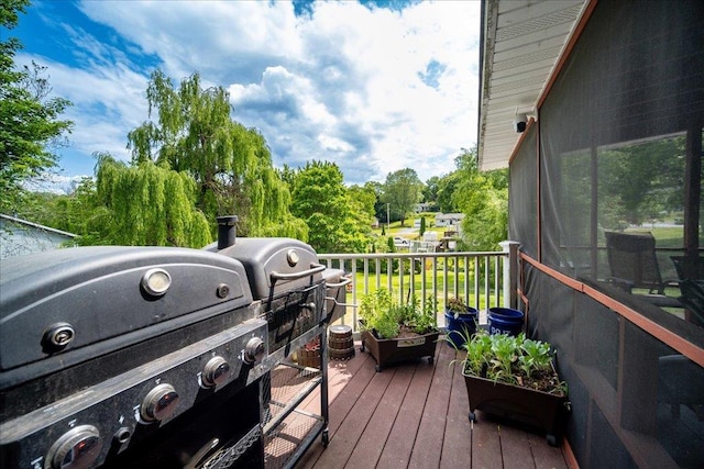 wooden deck featuring grilling area