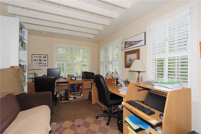 carpeted office with beamed ceiling