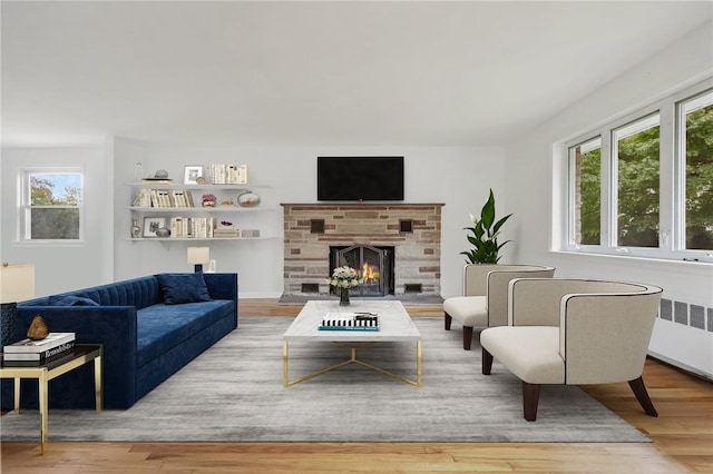 living room with hardwood / wood-style flooring and radiator