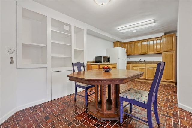 dining area featuring sink