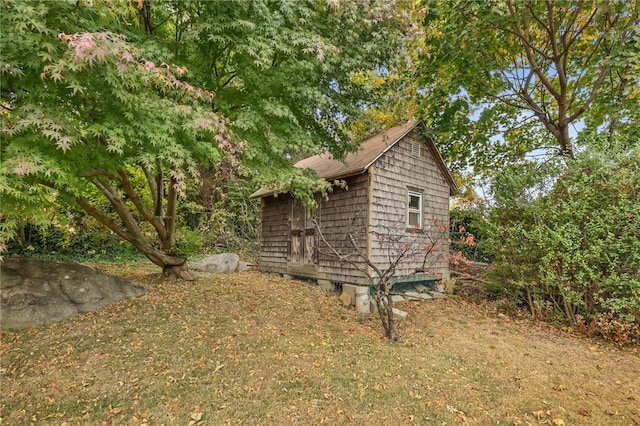 view of side of property with a shed