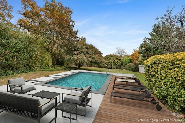 view of swimming pool featuring a wooden deck