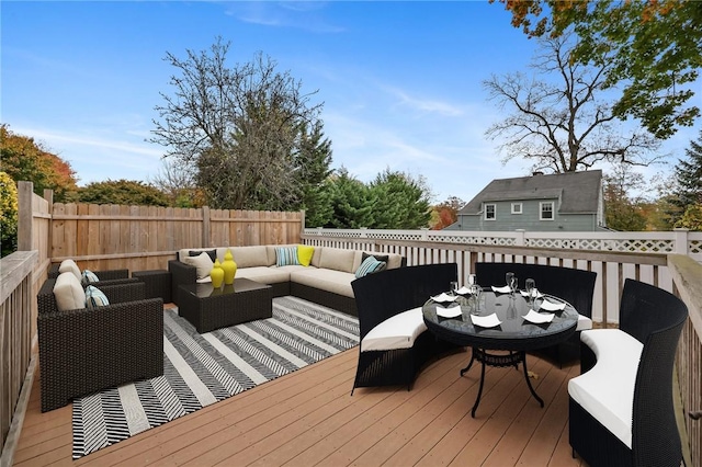 wooden deck with outdoor lounge area