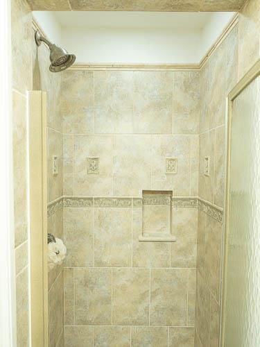 interior space featuring tiled shower