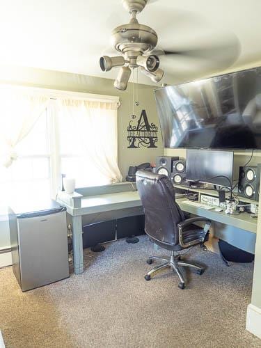 office featuring ceiling fan and carpet