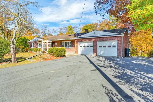 ranch-style home featuring a garage