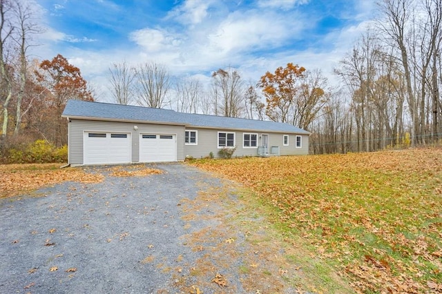 ranch-style house featuring a garage