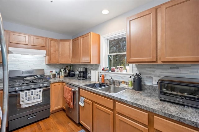 kitchen with sink, tasteful backsplash, light hardwood / wood-style flooring, stainless steel dishwasher, and range with gas stovetop