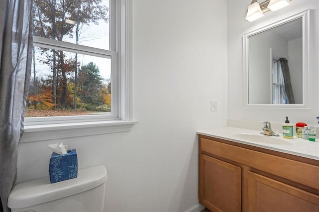 bathroom with vanity and toilet