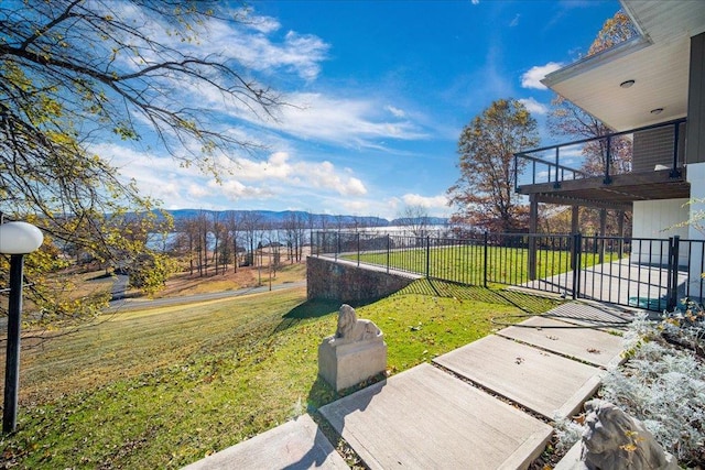 view of yard featuring a mountain view and a balcony