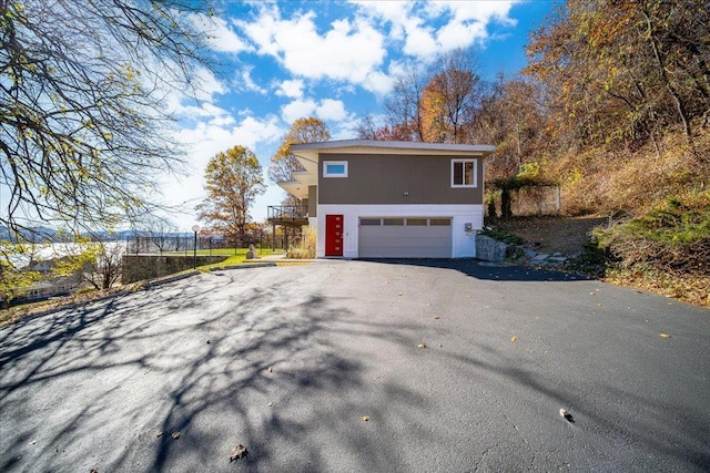 view of side of home with a garage