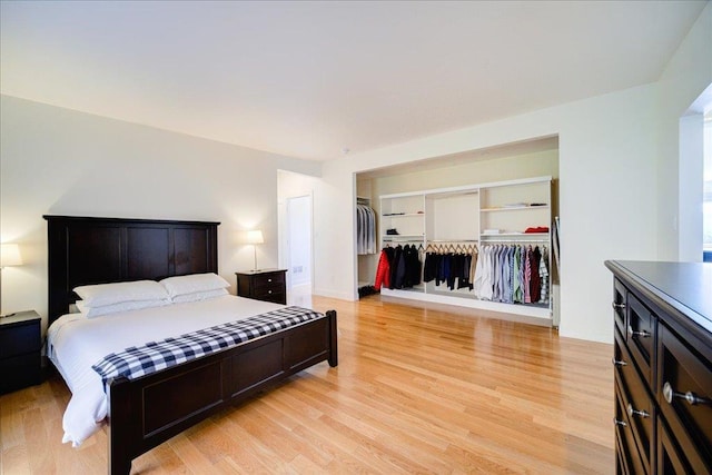 bedroom featuring a closet and light hardwood / wood-style flooring