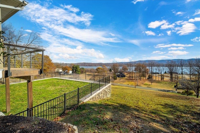 view of yard with a mountain view and a rural view