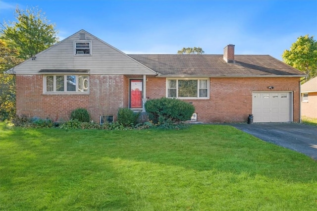 view of front of property featuring a garage and a front lawn