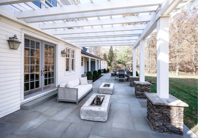 view of patio with french doors, a pergola, and a fire pit