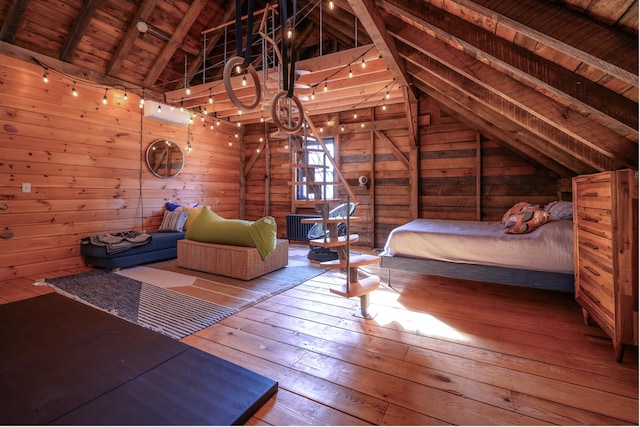 unfurnished bedroom featuring vaulted ceiling with beams, wood walls, wood-type flooring, and wood ceiling