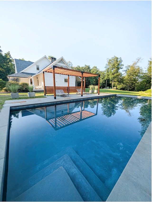 view of pool with a pergola and a patio