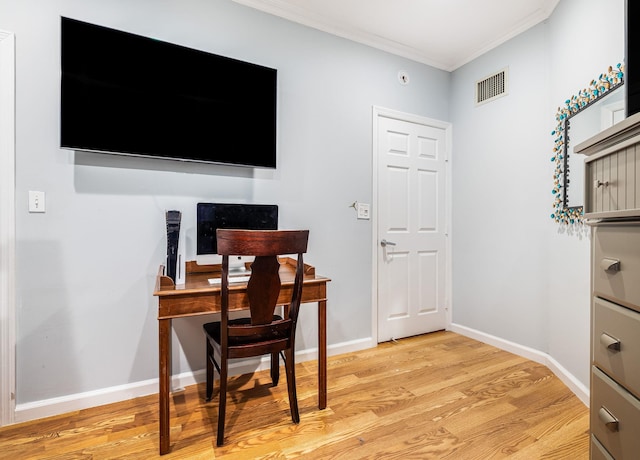 office area featuring ornamental molding and light hardwood / wood-style floors