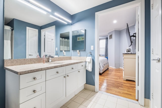 bathroom with vanity and tile patterned flooring