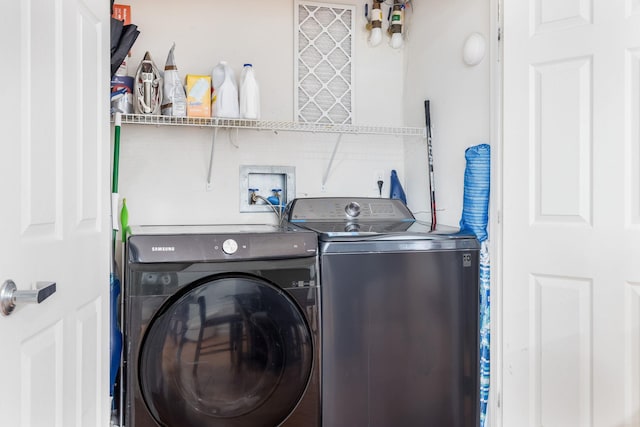 laundry area featuring washing machine and dryer