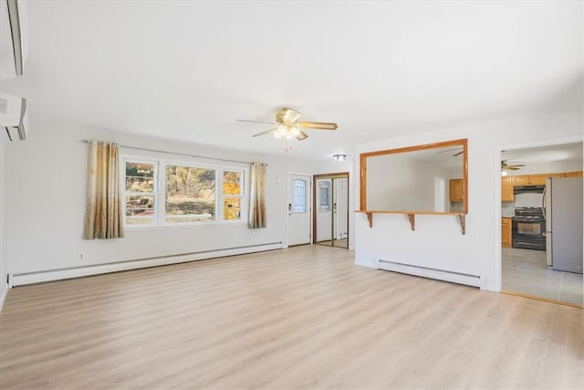 unfurnished living room with a baseboard radiator, a wall unit AC, and light hardwood / wood-style floors