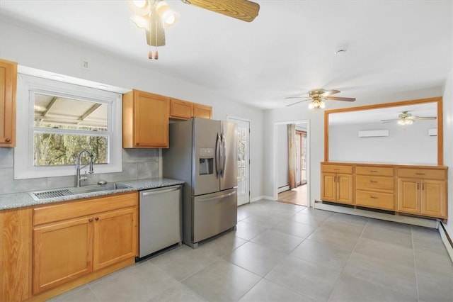 kitchen featuring a wall mounted AC, sink, tasteful backsplash, a baseboard radiator, and stainless steel appliances