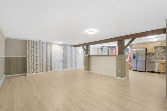 interior space with stainless steel fridge with ice dispenser and light hardwood / wood-style flooring