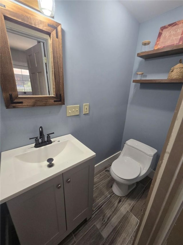 bathroom with vanity and toilet