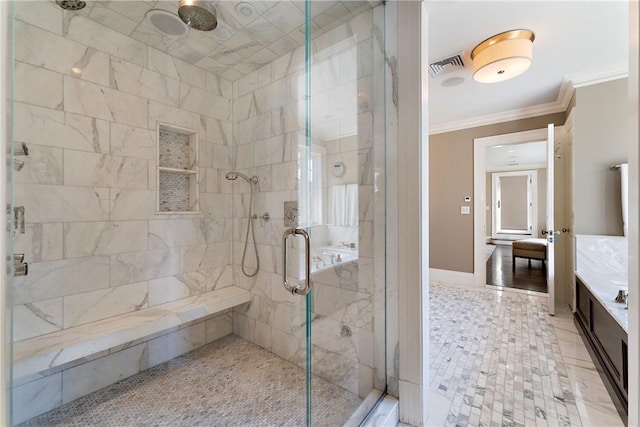 bathroom with a shower with door and ornamental molding