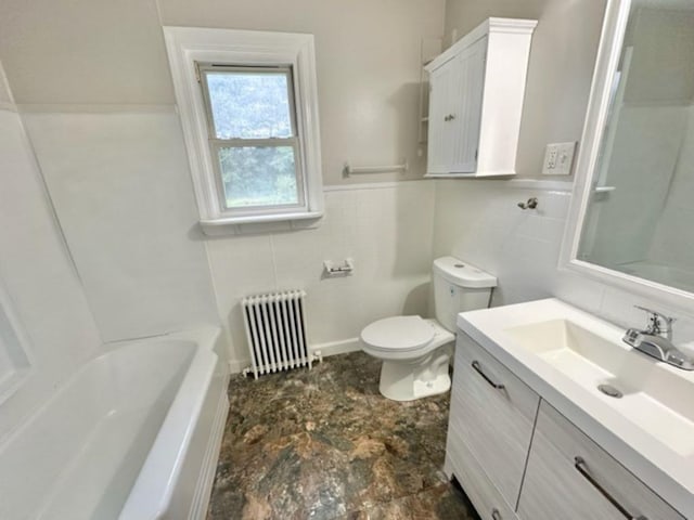 bathroom featuring radiator heating unit, vanity, toilet, and tile walls