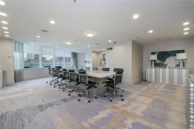 dining area with light colored carpet