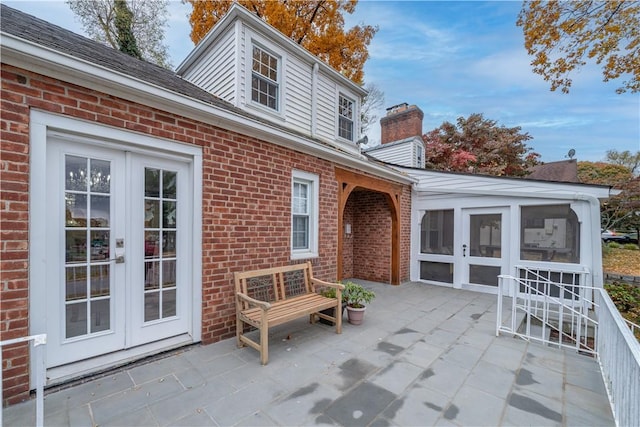 view of patio / terrace with a sunroom and french doors